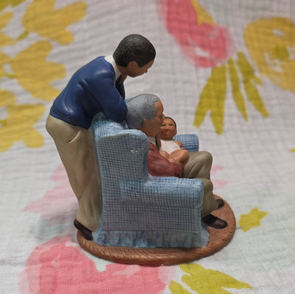 Family in Armchair Holding Baby Ceramic
