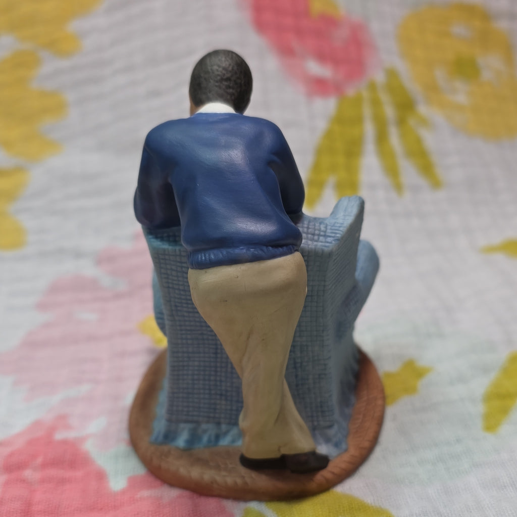 Family in Armchair Holding Baby Ceramic
