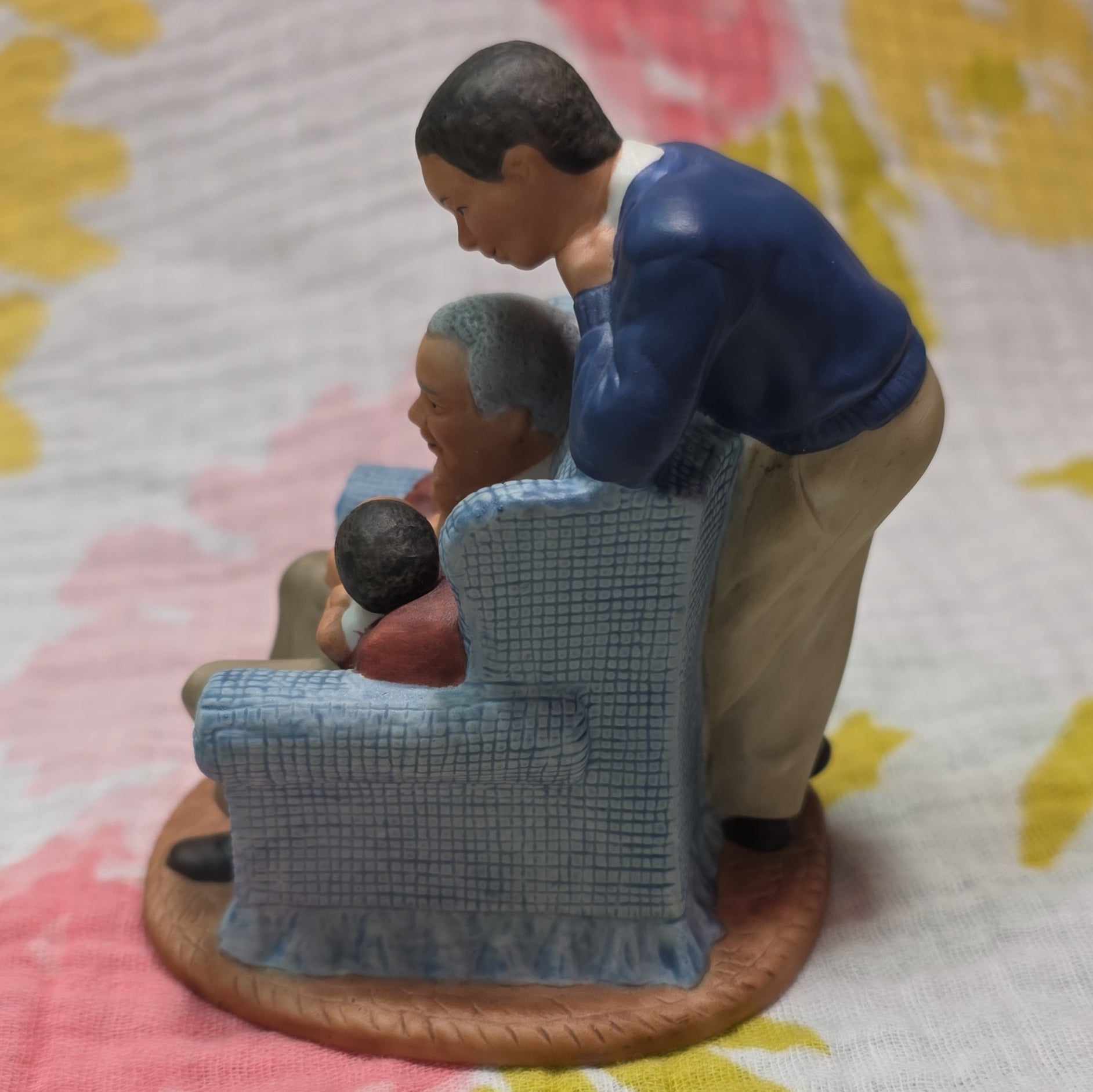 Family in Armchair Holding Baby Ceramic