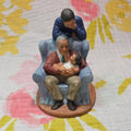 Family in Armchair Holding Baby Ceramic