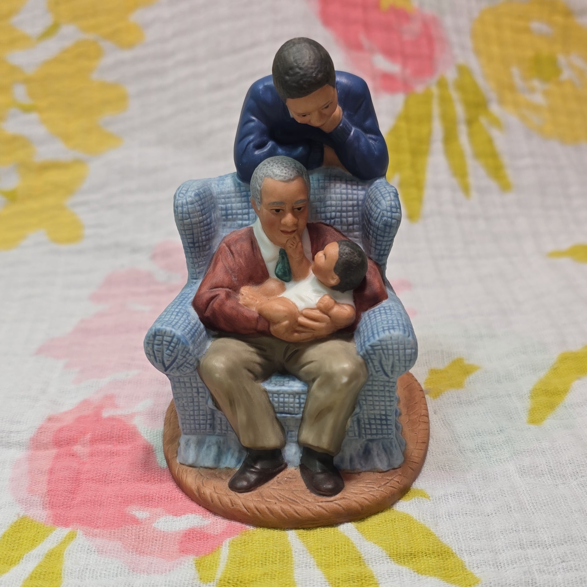 Family in Armchair Holding Baby Ceramic